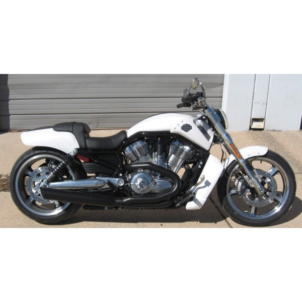 White motorcycle with black seat parked on a concrete surface.