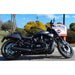 Black motorcycle parked on a road with a Colonial Harley-Davidson sign in the background.