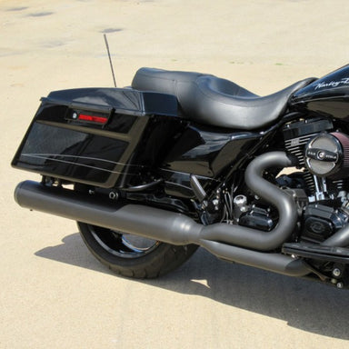 Black motorcycle parked on a sandy surface