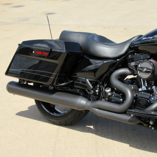 Black motorcycle parked on a sandy surface