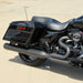 Black motorcycle parked on a sandy surface