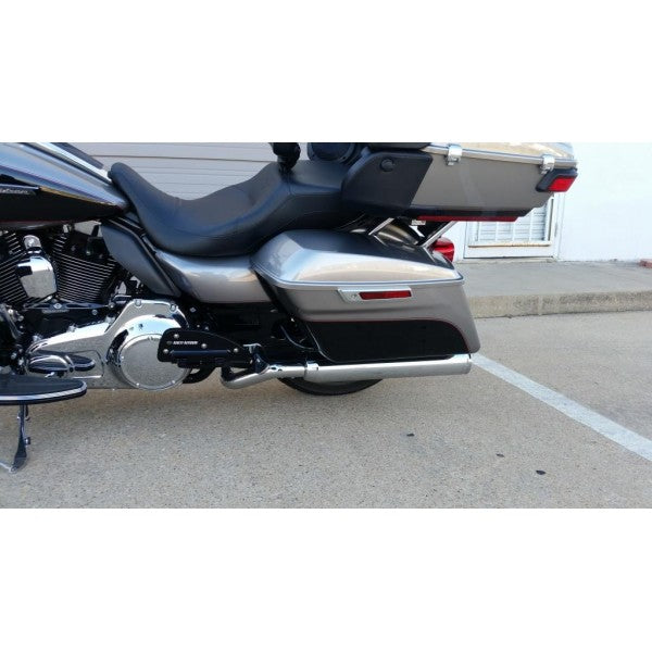 Motorcycle parked on a concrete surface with a building in the background