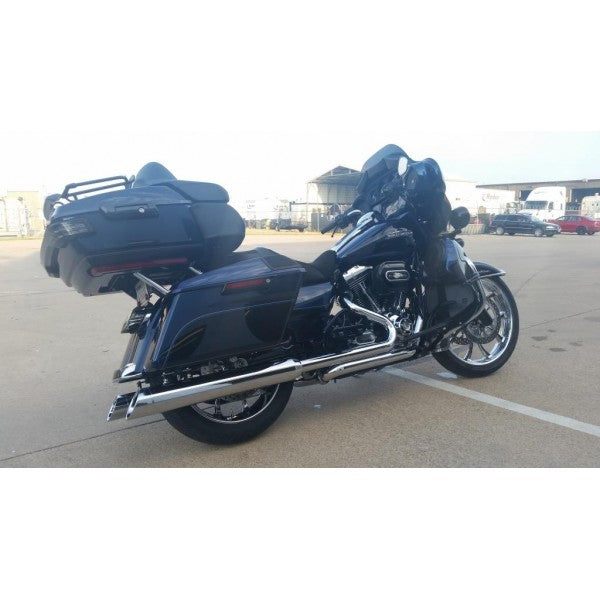 Black motorcycle with luggage on a paved surface