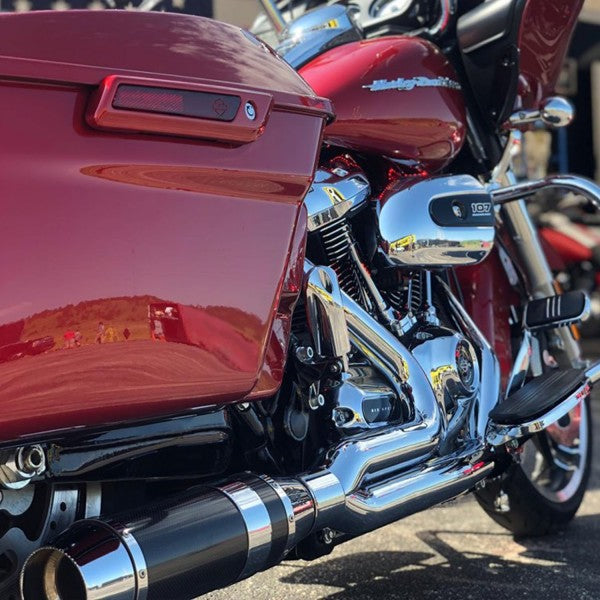 Close-up of a maroon motorcycle with chrome details