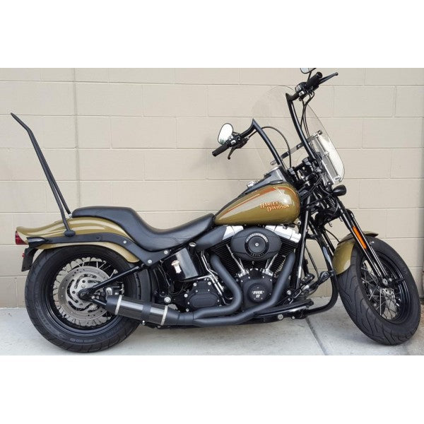 Harley Davidson motorcycle parked on a concrete surface with a light-colored wall in the background