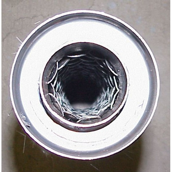Metallic bearing with a central bore on a gray background