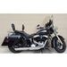 Black motorcycle parked against a beige wall