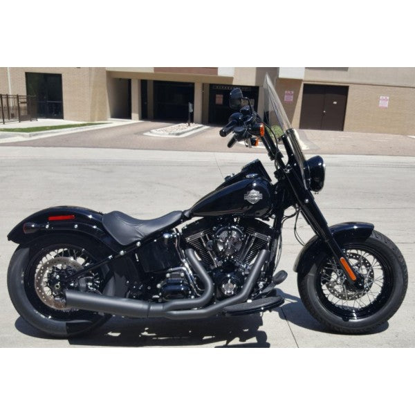 Black motorcycle parked on a street with a building in the background