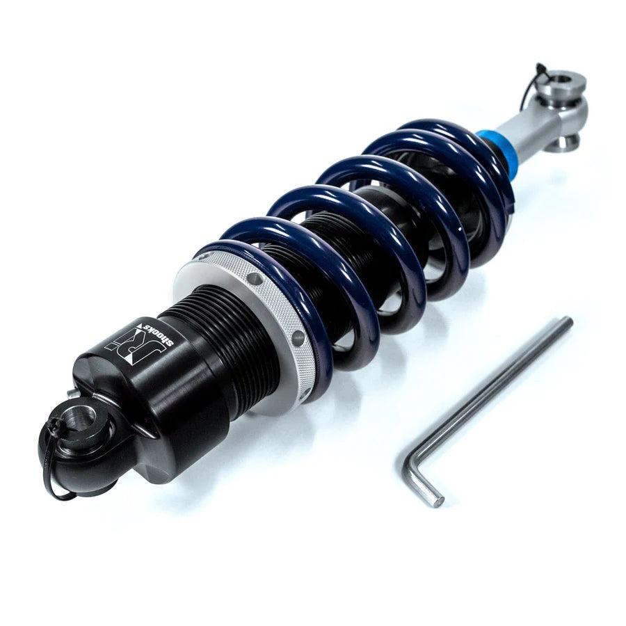 Shock absorber with a tool on a white background