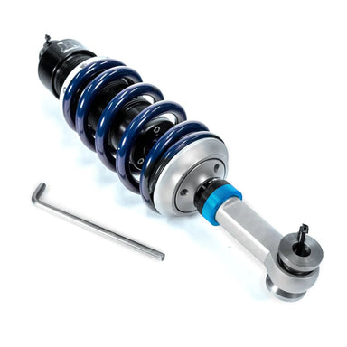 Car suspension shock absorber with blue springs on a white background