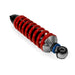 Red shock absorber with metal components on a white background