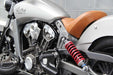 Close-up of a motorcycle with visible branding on a gray background