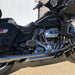 Harley-Davidson motorcycle parked on a concrete surface with a white wall in the background