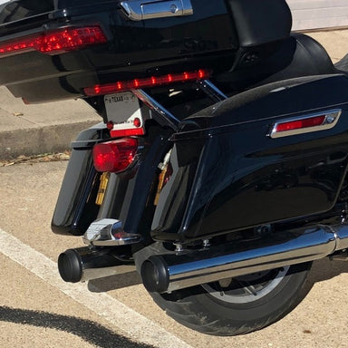 Close-up of a black motorcycle's rear end with visible license plate and taillights.