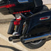 Close-up of a black motorcycle's rear end with visible license plate and taillights.