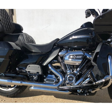 Black motorcycle with chrome details on a paved surface