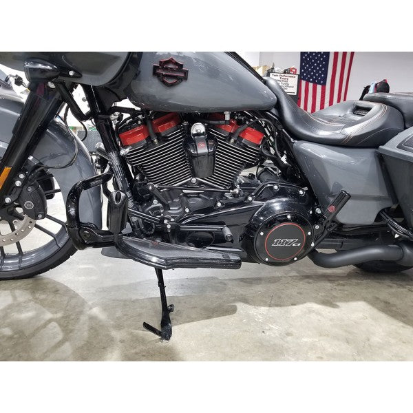 Harley Davidson motorcycle with American flag in the background