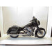 Black motorcycle on a white platform with a white background
