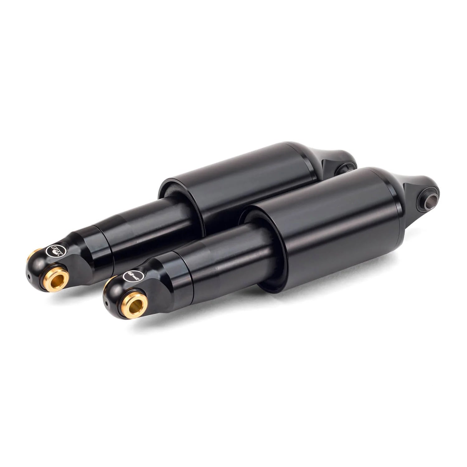 Two black shock absorbers with gold accents on a white background