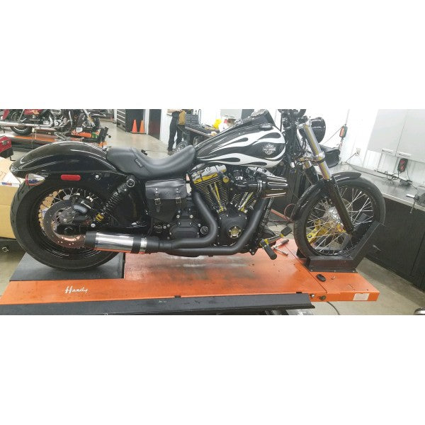 Motorcycle on a lift in a garage setting