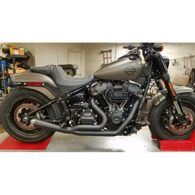 Motorcycle on a red platform in a garage setting