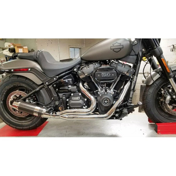 Harley Davidson motorcycle on a lift in a garage setting
