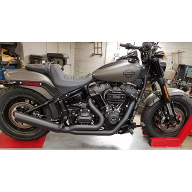 Harley Davidson motorcycle on display in a garage setting