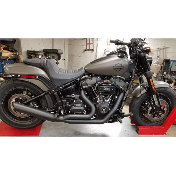 Harley Davidson motorcycle on display in a garage setting