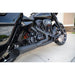 Close-up of a black motorcycle parked on a concrete surface.