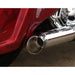 Close-up of a red motorcycle with a chrome exhaust pipe.