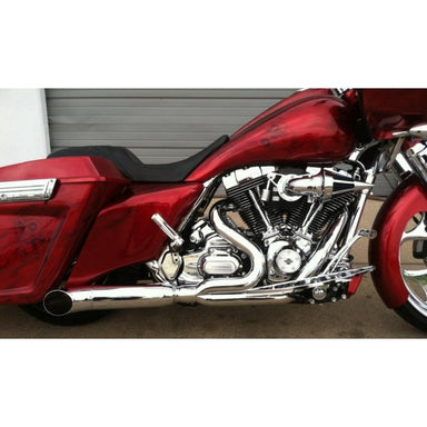 Close-up of a red motorcycle with chrome details on a white background