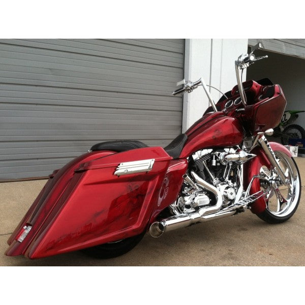 Red motorcycle parked in front of a garage door