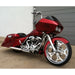 Red motorcycle parked in front of a gray building